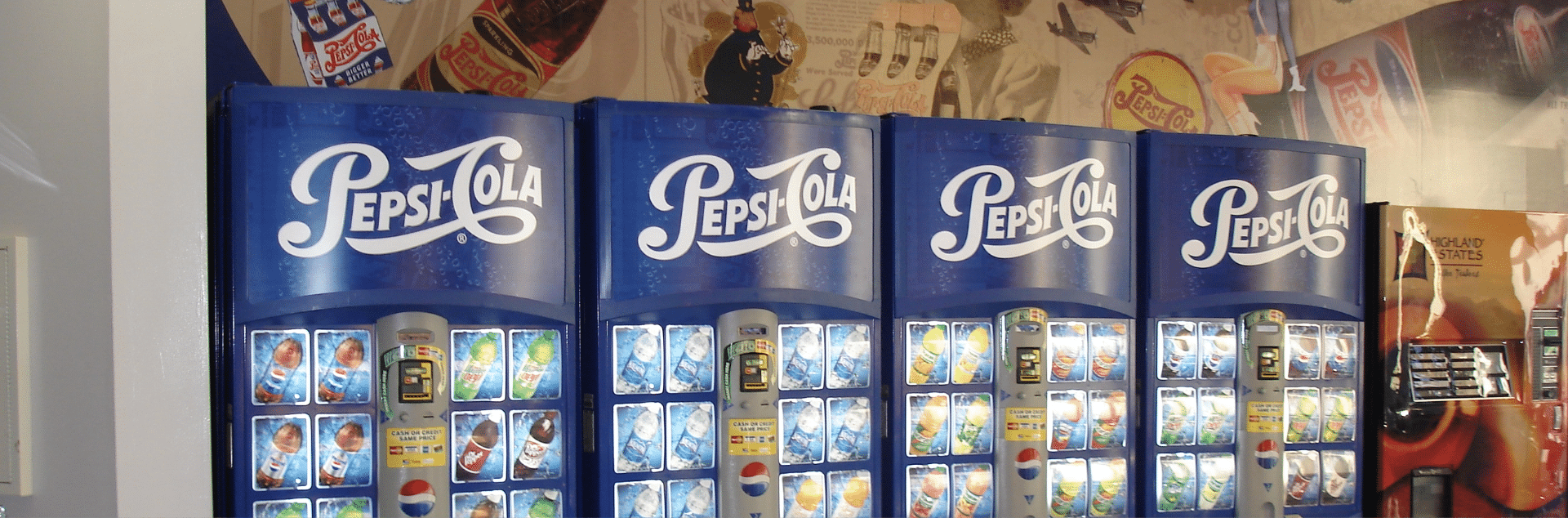 Pepsi Cola Drink Machines With Mural Behind